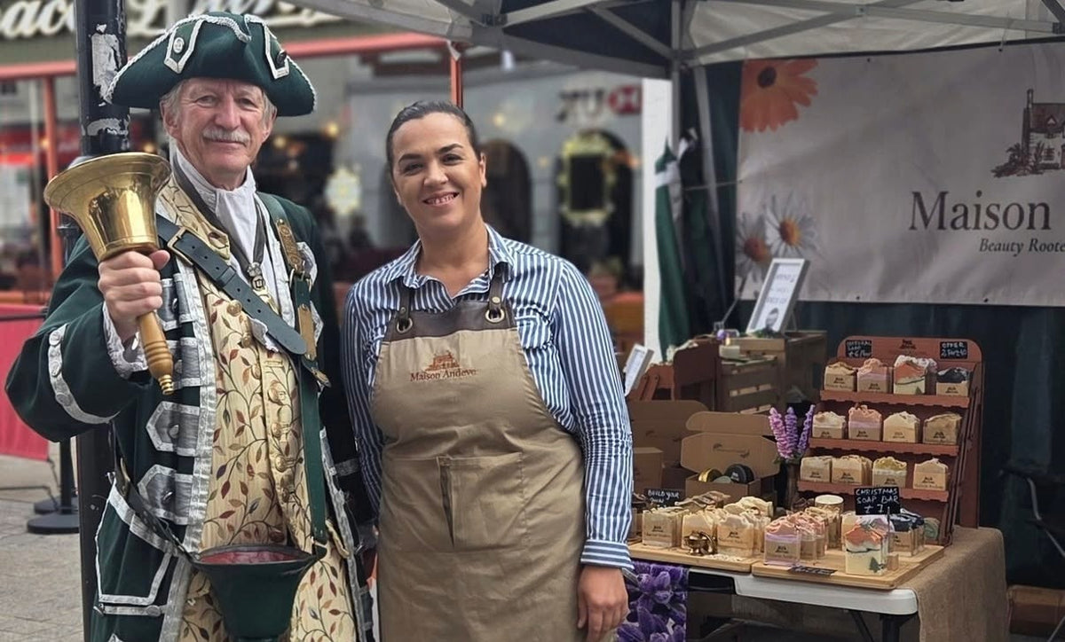 Maison Andeve handmade natural skincare stall at Bromsgrove High Street Market with the founder and Bromsgrove town crier