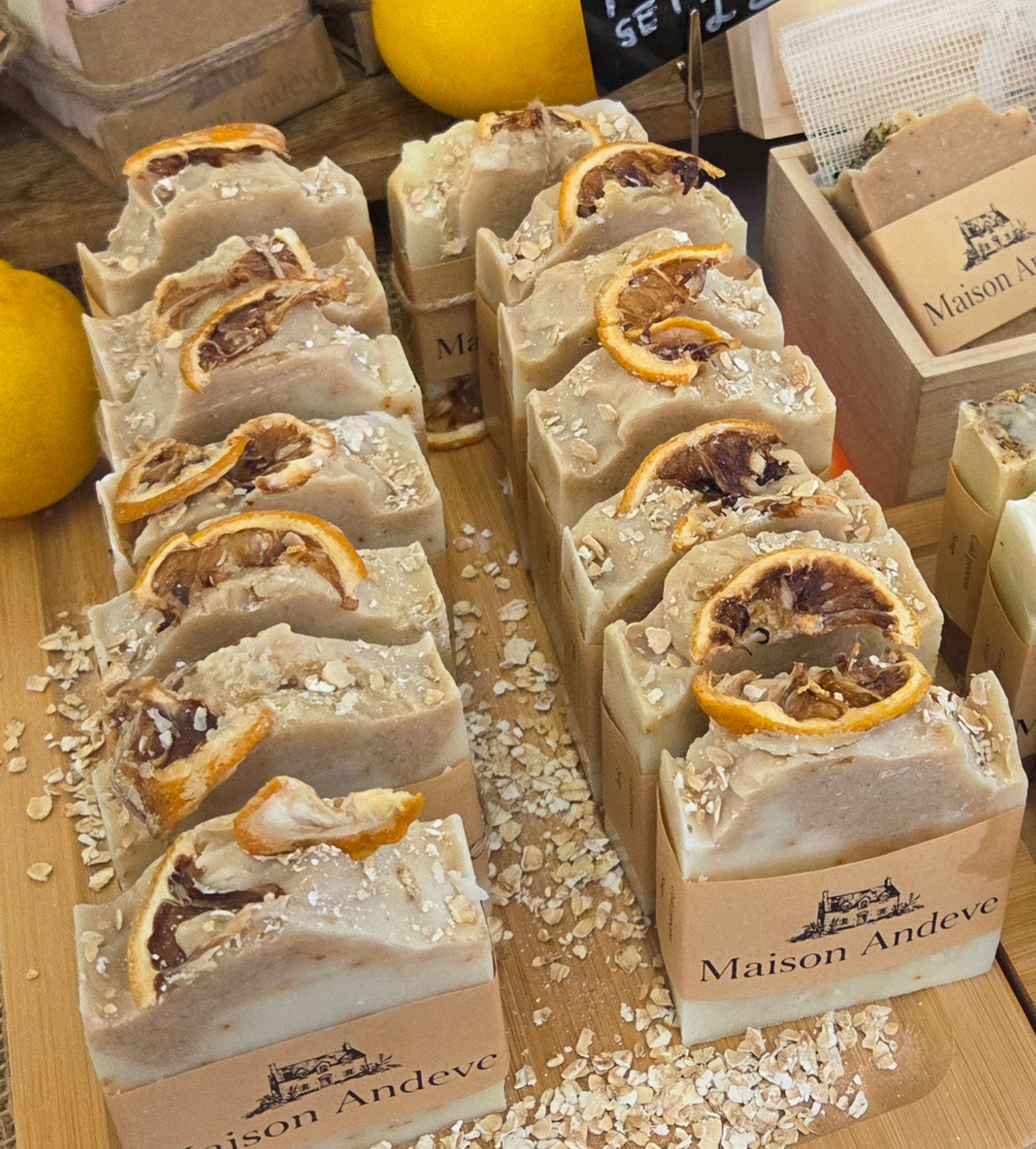 Maison Andeve handmade citrus and oat soap bars with dried orange slices, natural exfoliating skincare products