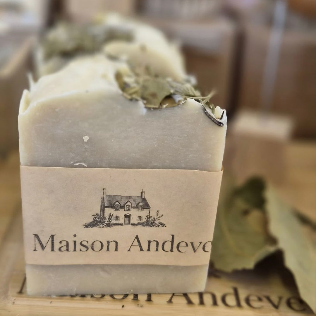 Maison Andeve handmade botanical soap bar with natural ingredients and soft background, artisan skincare
