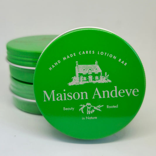 Stack of Maison Andeve mint and citronella lotion bars in green tins, natural insect repellent skincare product