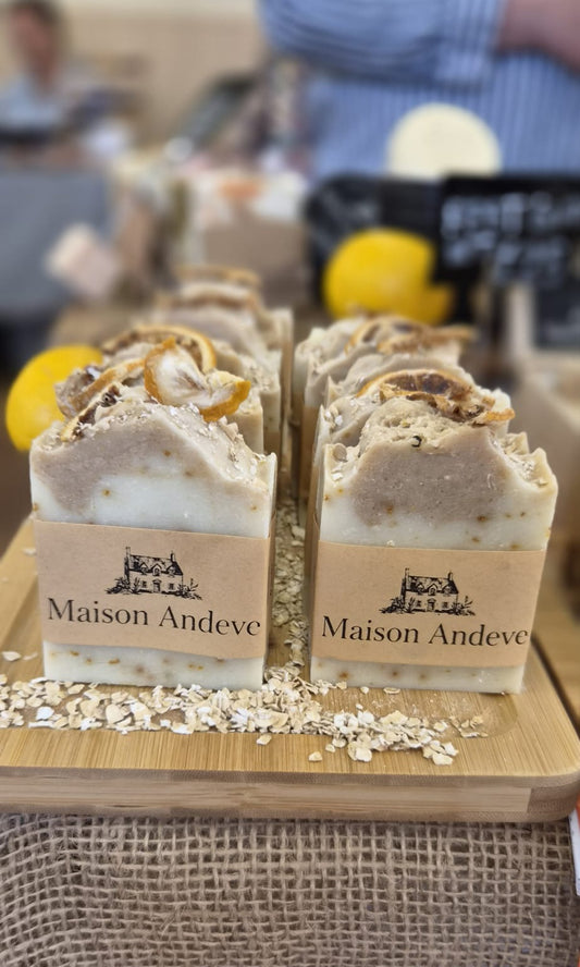 Maison Andeve oat and lemon handmade soap bar with natural exfoliating ingredients displayed on wooden board